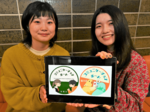 指さしで意思伝達「コミュニケーションボード」 設置場所を一目で 鳥大生がステッカーデザイン考案
